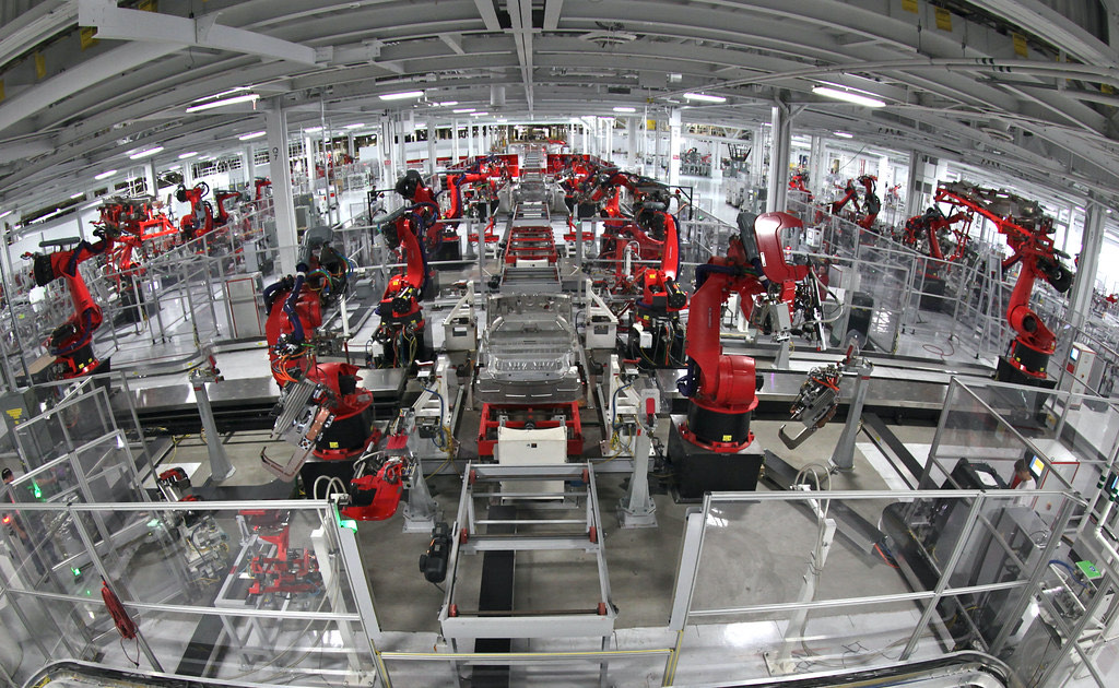 Wide view of an automated assembly hall with conveyor lines